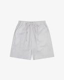 Front flat shot of Uskees off-white shorts for men. Clear view of drawstring, elasticated waist and Uskees branding label.