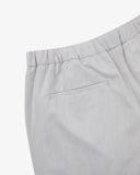 Back view close up shot of Uskees off-white shorts for men showing the left back pocket.