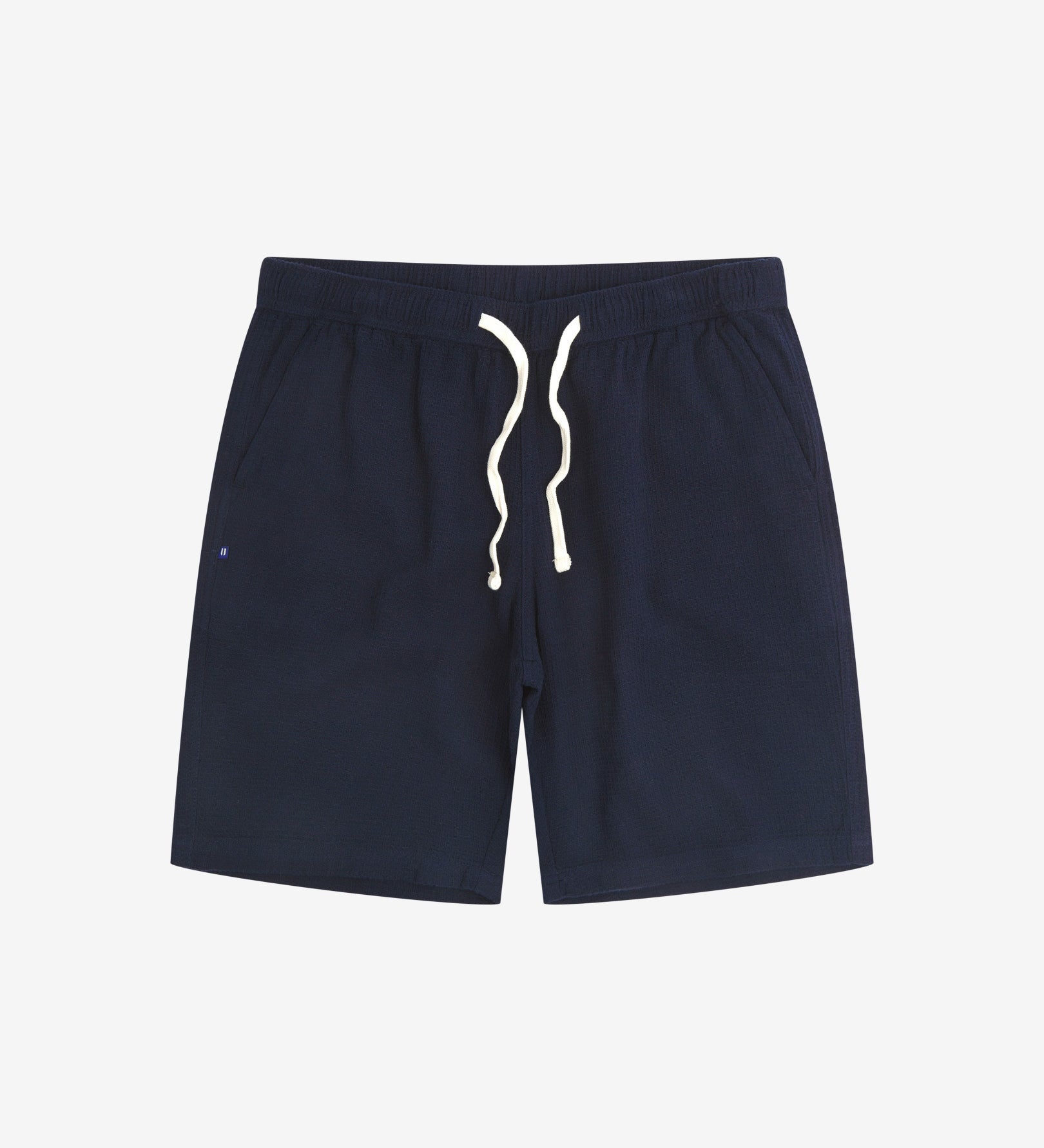 Front view of deep-blue #6009 waffle cotton shorts. Clear view of white drawstring, side pockets and small Uskees tag label.
