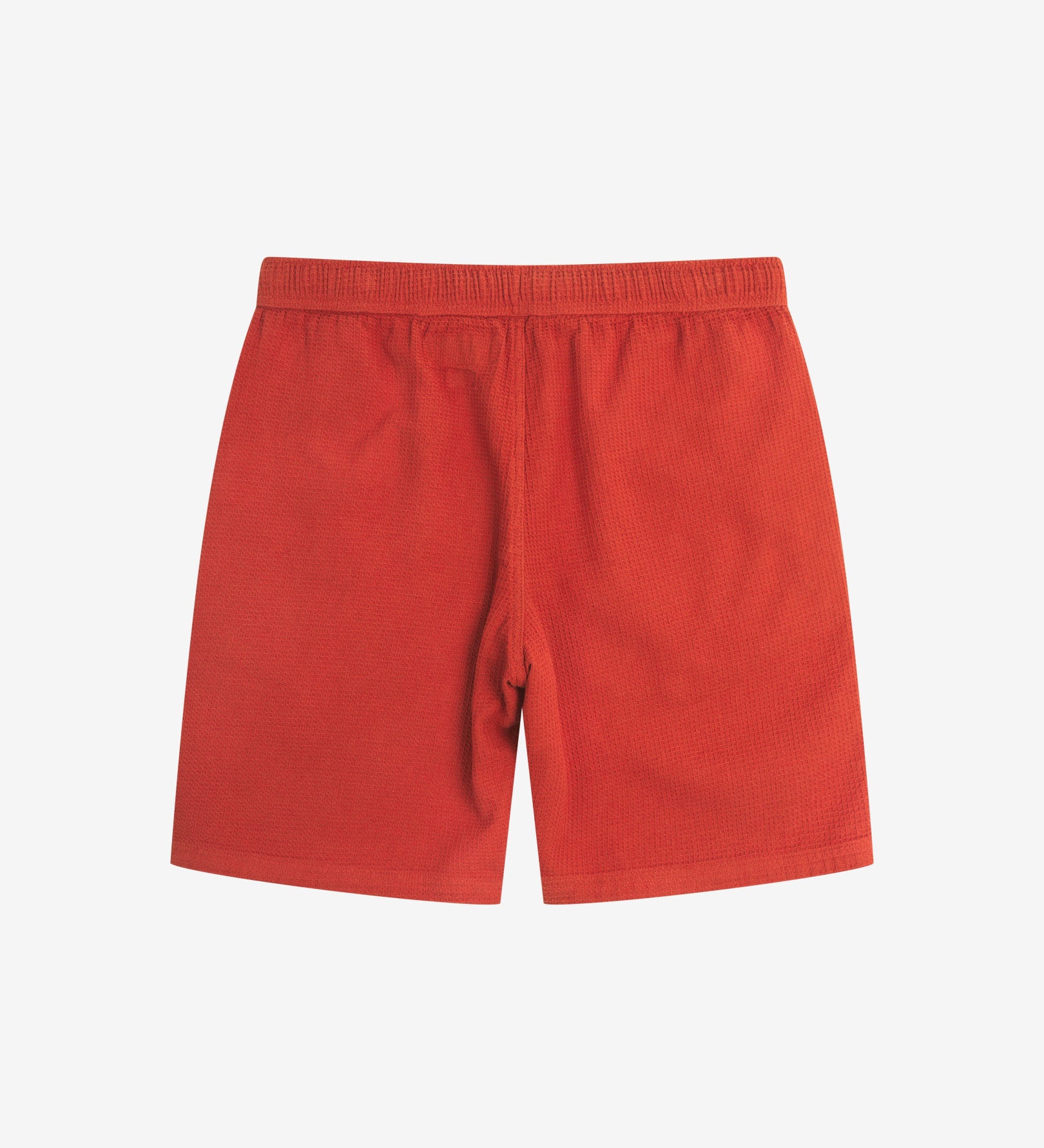 Back view of rust-red #6009 waffle cotton shorts by Uskees with clear view of lightweight elasticated waistband.