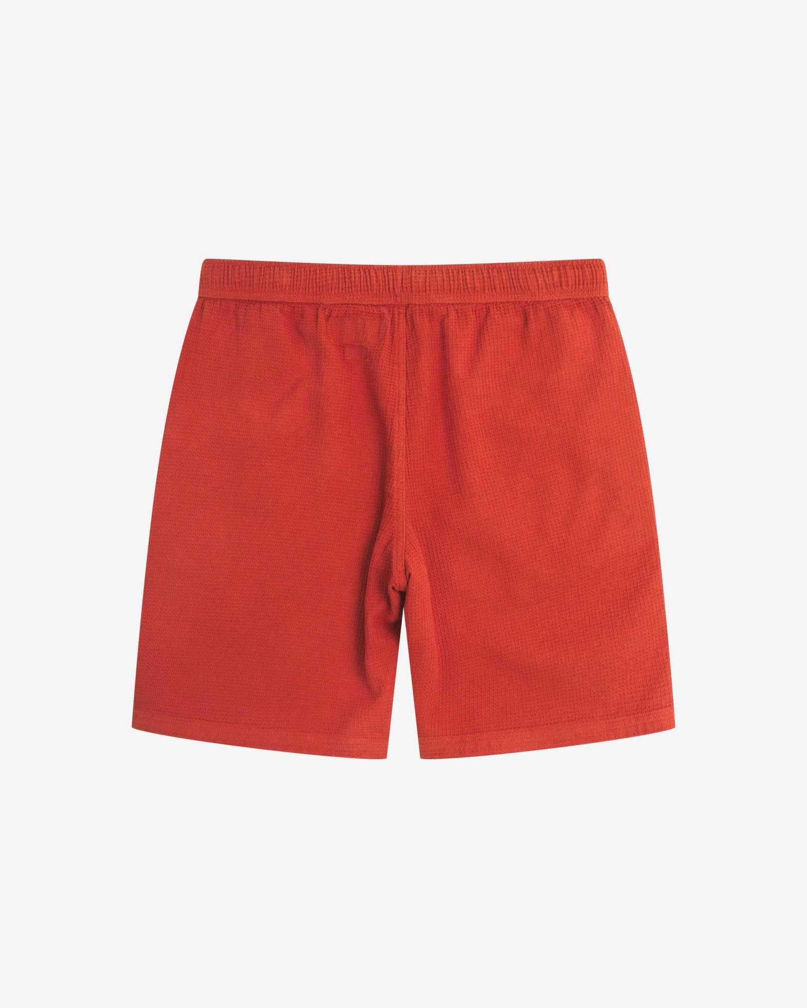 Back view of rust-red #6009 waffle cotton shorts by Uskees with clear view of lightweight elasticated waistband.