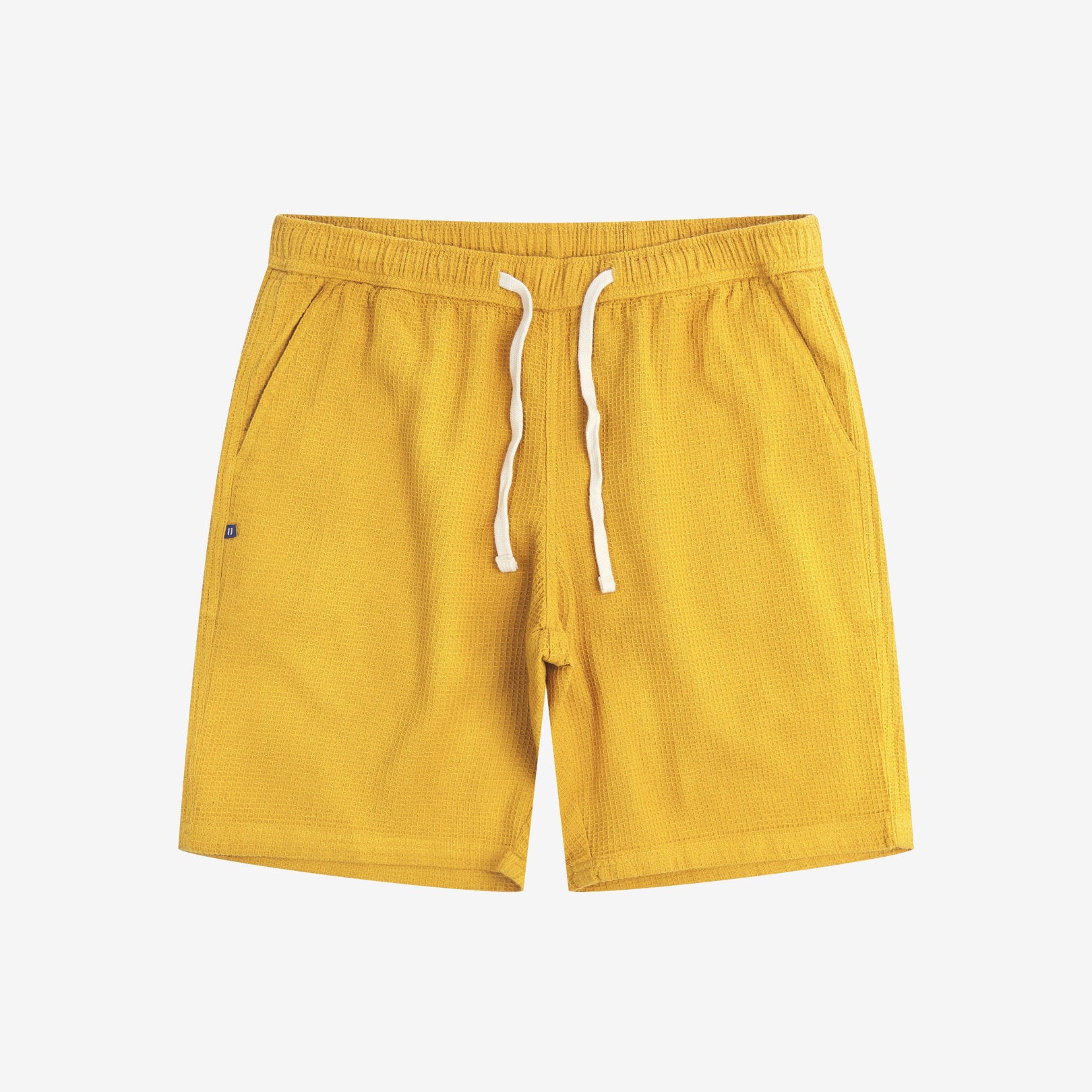 Front view of yellow #6009 waffle cotton shorts by Uskees. Clear view of white drawstring, side pockets and small Uskees tag label.