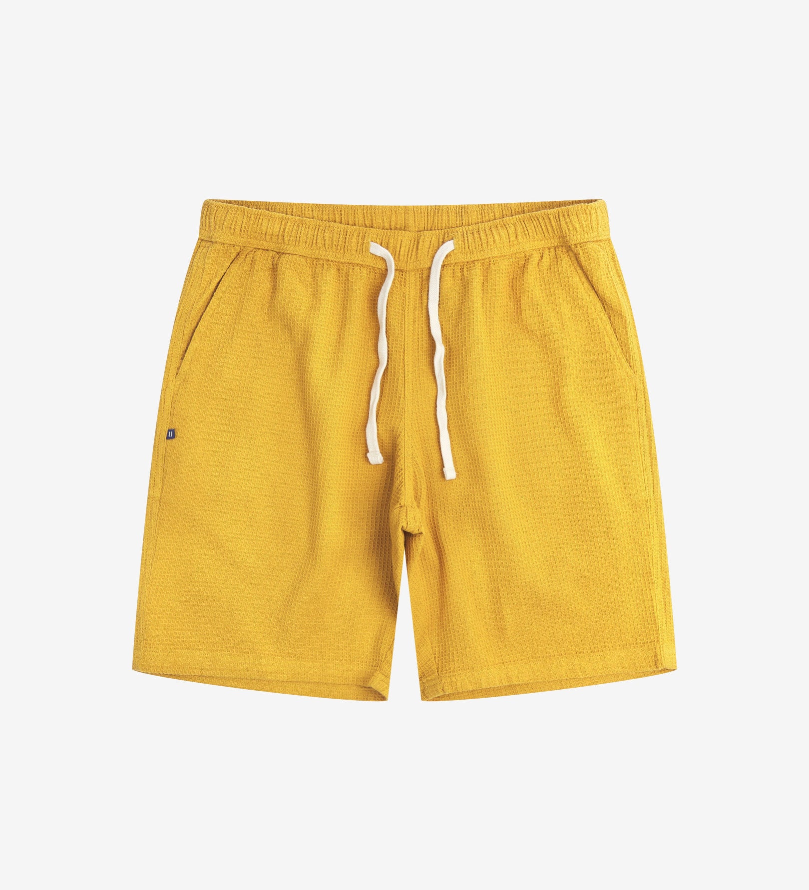 Front view of yellow #6009 waffle cotton shorts by Uskees. Clear view of white drawstring, side pockets and small Uskees tag label.