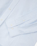Uskees light blue and white striped men's Oxford shirt showing the buttons, cuff and pinstripe pattern.
