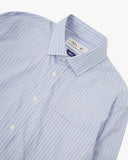 Close up view of Uskees blue, gold and white striped men's Oxford shirt with focus on collar and Uskees brand label.