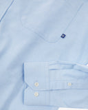 Uskees light blue men's Oxford shirt showing the buttons, cuff and weave.