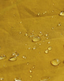 Magnified view of the dry waxed fabric, demonstrating the material's water repellent properties.