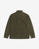 Reverse view of the dark 'Pennine' green Uskees wax storm jacket showing the boxy silhouette, Halley Stevenson dry wax fabric, hanging loop and adjustable hem.