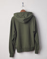 Back view of vine green organic heavyweight cotton #7004 jersey hooded sweater by Uskees presented on hanger.
