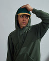 Front view of model #7004 hoodie sweater with hood up and view of ribbed cuffs.