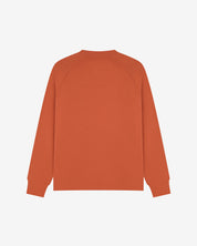 Back view of men's cinnamon-orange organic heavyweight cotton 7005 jersey sweatshirt by Uskees, showing ribbed cuffs and hem.