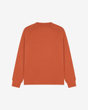 Back view of men's cinnamon-orange organic heavyweight cotton 7005 jersey sweatshirt by Uskees, showing ribbed cuffs and hem.