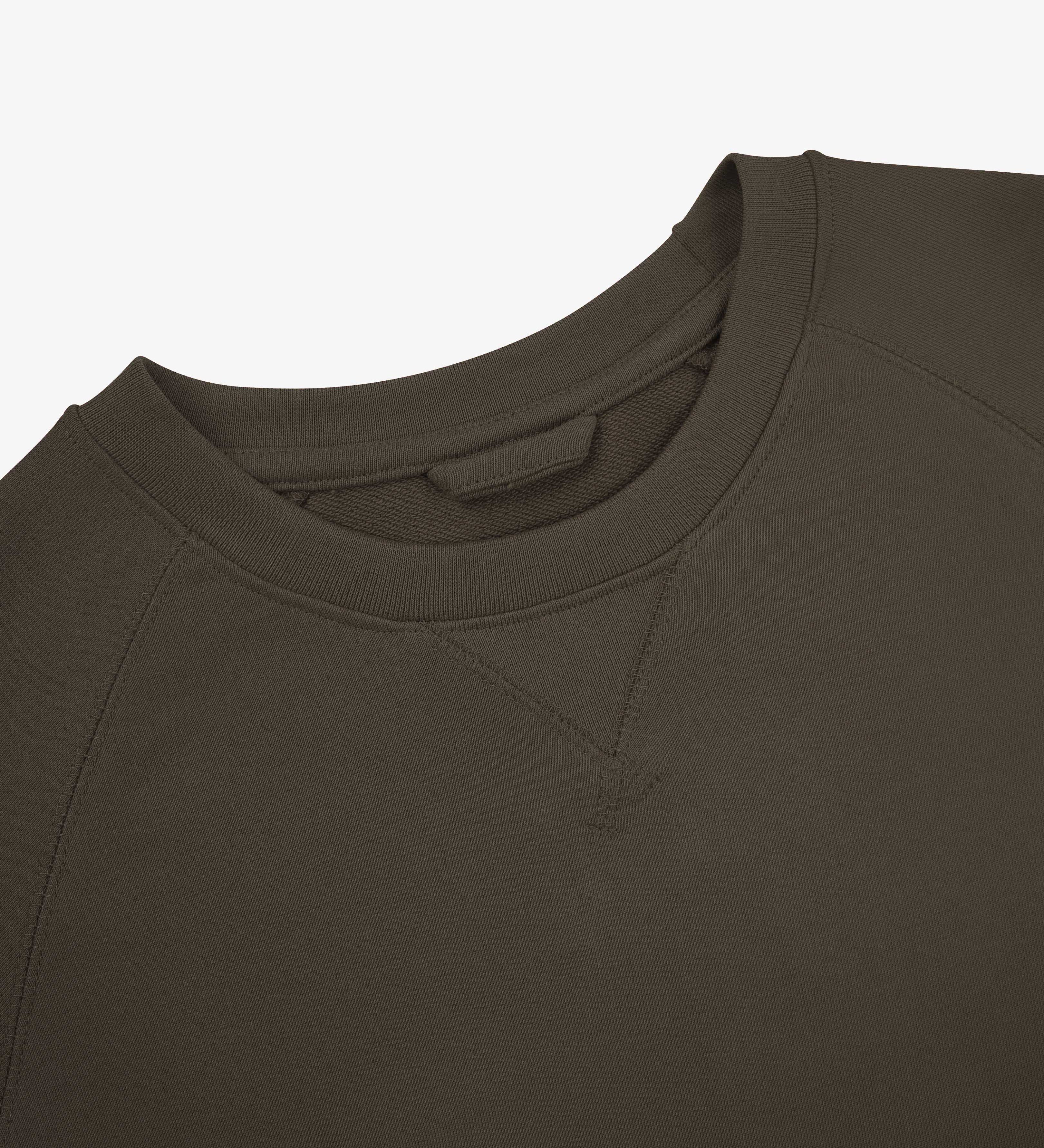 Close-up view of crew neck collar with decorative v-insert on Uskees dark taupe heavyweight cotton jersey sweatshirt.