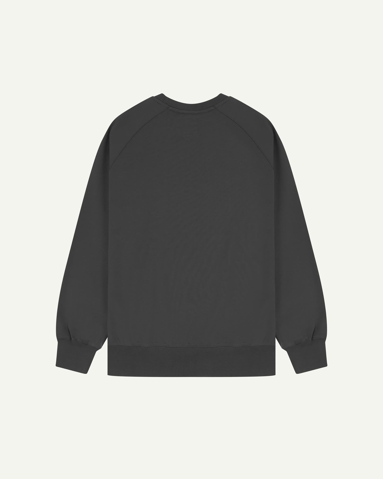 Back view of men's faded black organic heavyweight cotton 7005 jersey sweatshirt by Uskees, showing ribbed cuffs and hem.
