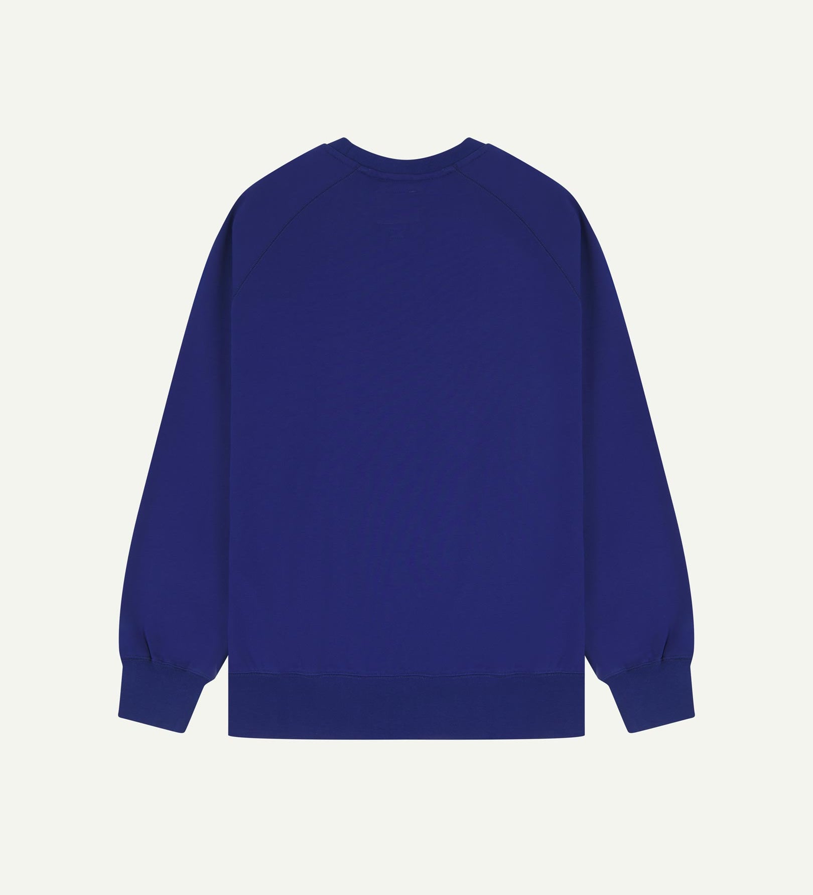 Back view of men's ultra-blue organic heavyweight cotton 7005 jersey sweatshirt by Uskees, showing ribbed cuffs and hem.