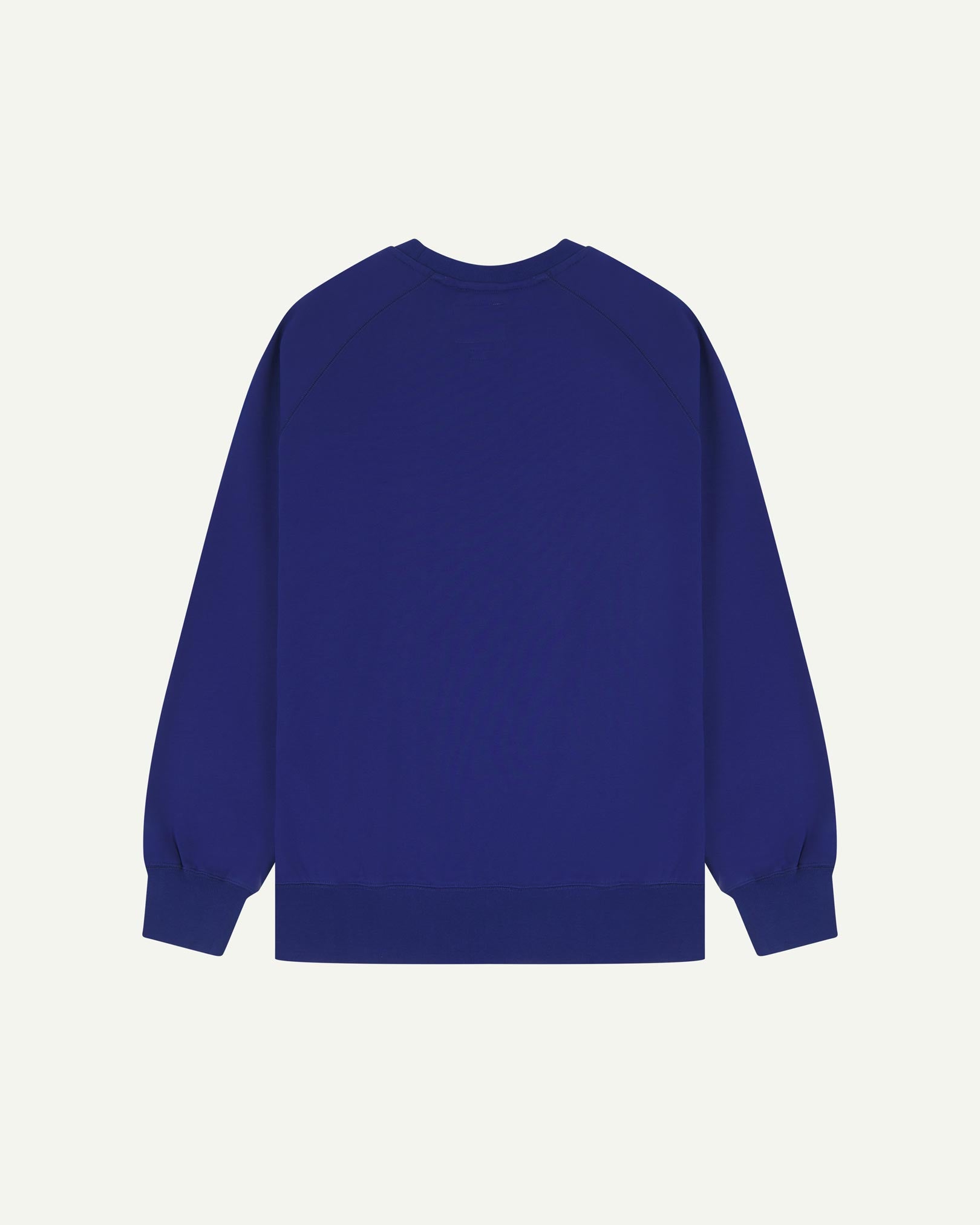 Back view of men's ultra-blue organic heavyweight cotton 7005 jersey sweatshirt by Uskees, showing ribbed cuffs and hem.