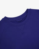 Close-up view of crew neck collar with decorative v-insert on Uskees vibrant blue heavyweight cotton jersey sweatshirt.