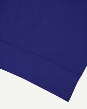 Close up shot of organic heavyweight cotton 7005 sweatshirt by Uskees in ultra blue.