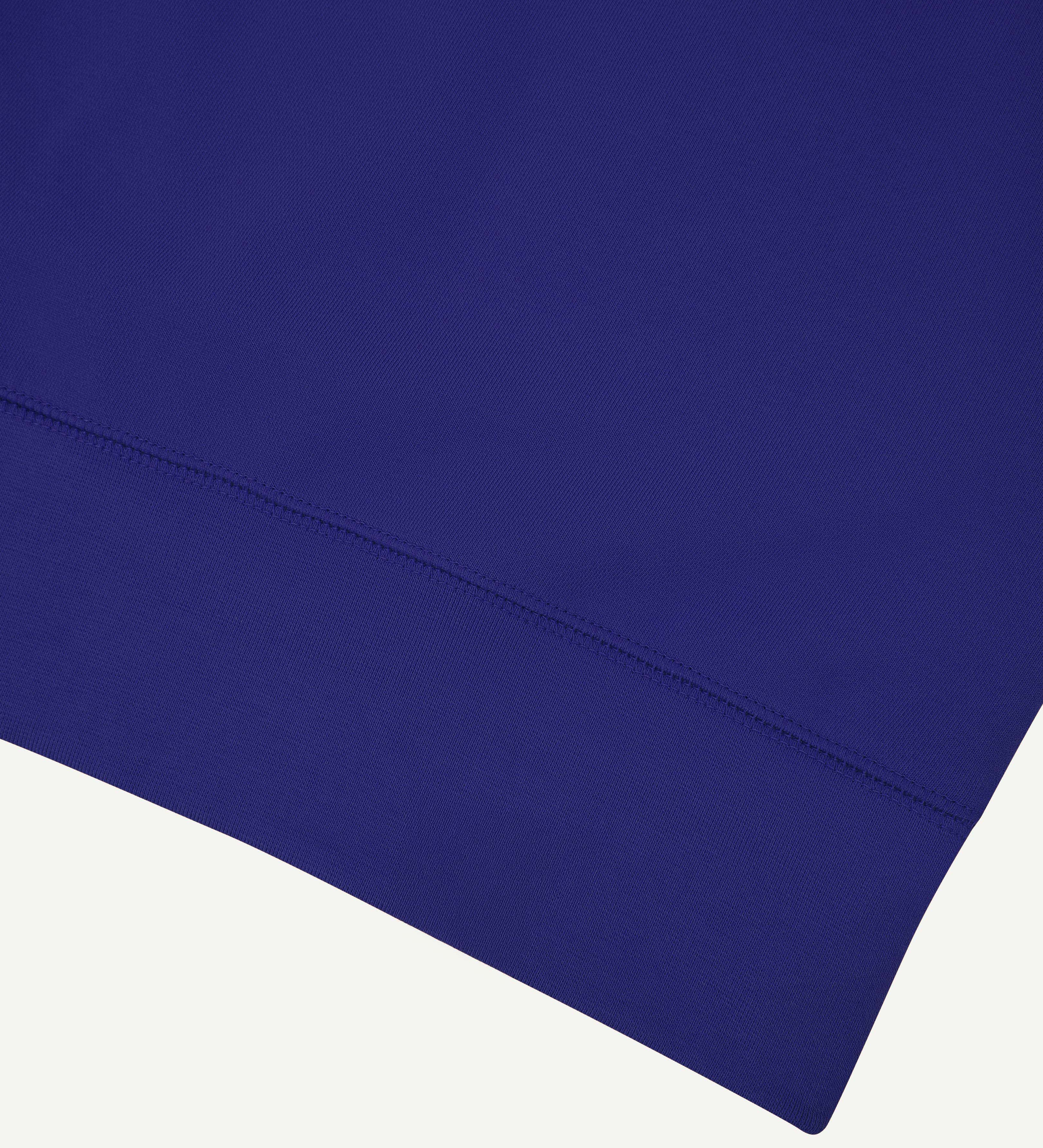 Close up shot of organic heavyweight cotton 7005 sweatshirt by Uskees in ultra blue.