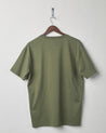 Back view of army green organic cotton #7006 jersey T-shirt by Uskees. Presented on hanger against white background.