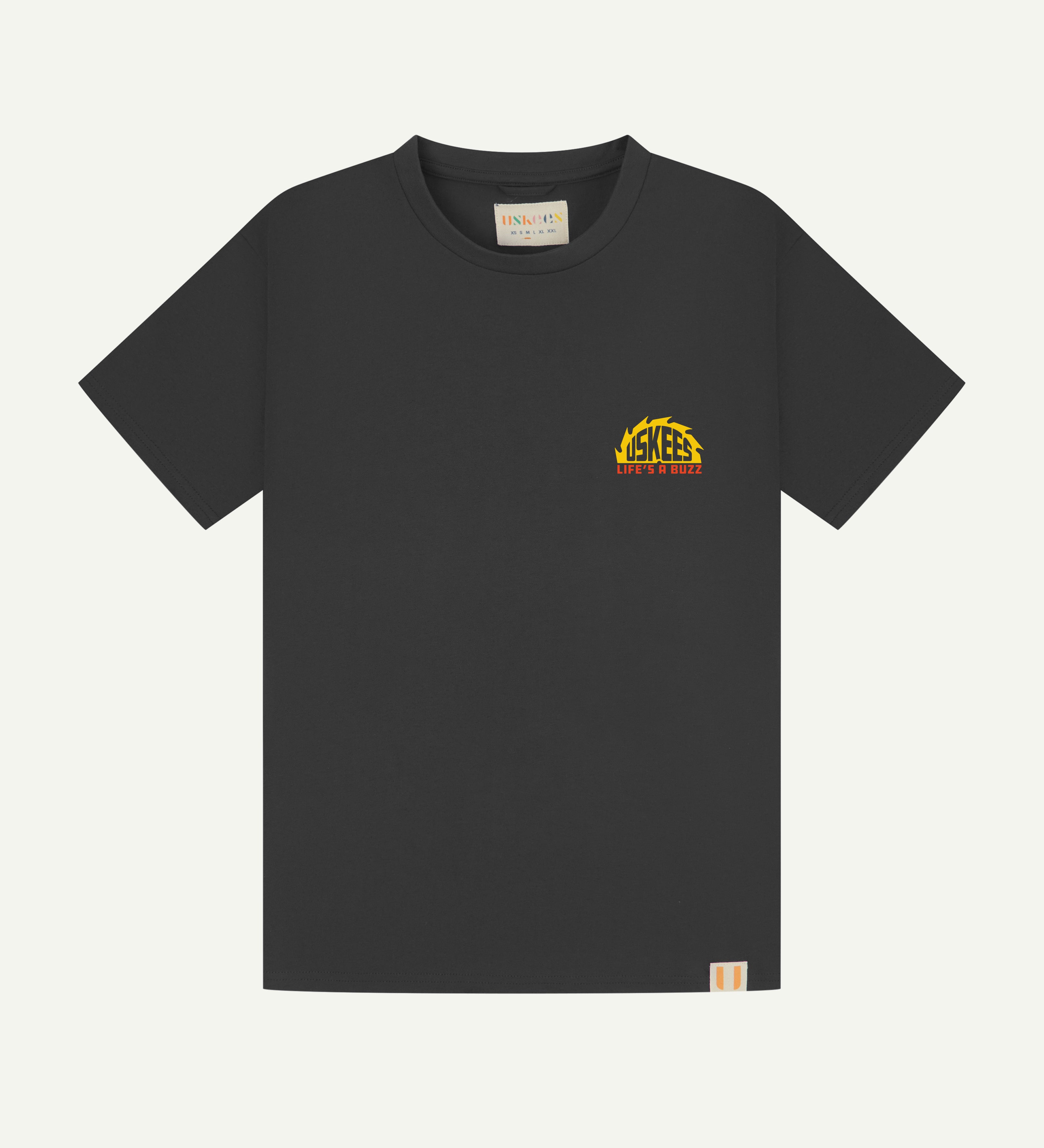 Flat shot of uskees graphic 'life's a buzz' short sleeve Tee for men showing the small graphic logo.