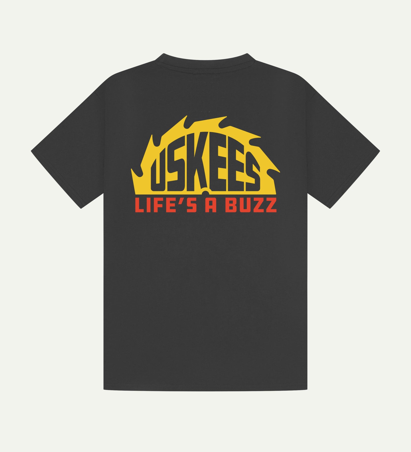 Reverse view of Uskees men's graphic 'life's a buzz' short sleeve Tee for men showing the large graphic buzz saw logo in yellow and orange across the back.