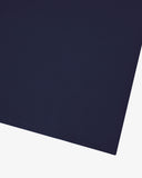 Hem close-up of the dark blue/indigo organic cotton T-shirt showing texture of the medium weight organic cotton jersey.