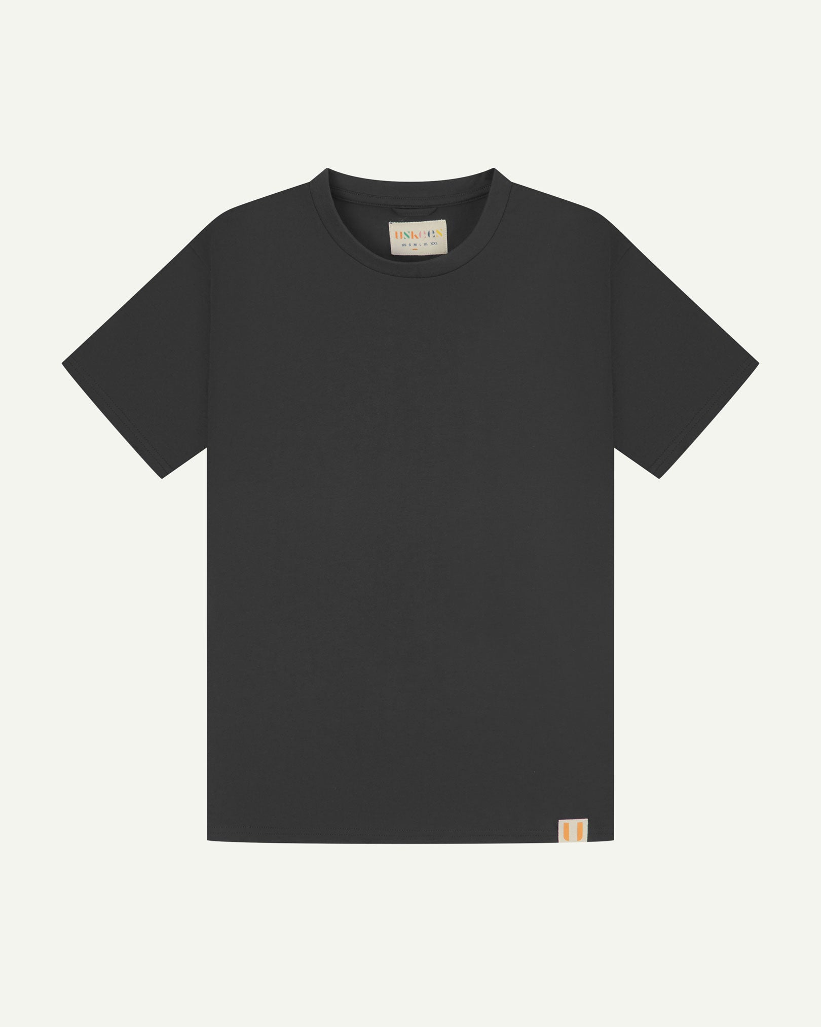 Full flat view of faded black organic cotton Uskees T-shirt for men.