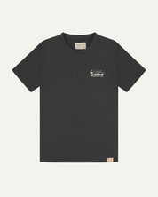 Full flat view of faded black organic cotton Uskees T-shirt for men, showing the small white 'diner' logo on the breast and the Uskees branding labels on the neck and hem.