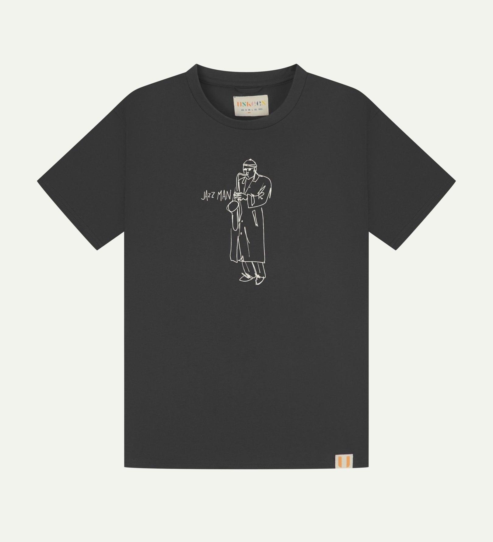 Full flat view of faded black organic cotton Uskees T-shirt for men, showing the white 'Jazz Man' logo on the chest and the Uskees branding labels on the neck and hem.