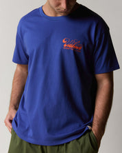 Front view wearing the uskees men's 'diner' tee in ultra blue demonstrating the loose, relaxed fit.