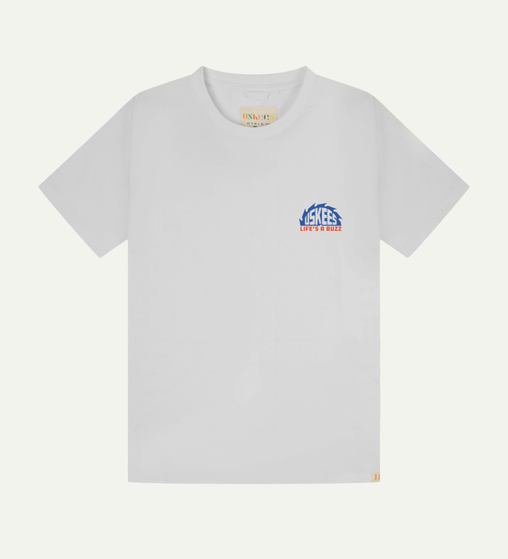 Front flat view of men's graphic t-shirt in white showing a smaller 'life's a buzz' graphic on the left breast and the Uskees branding labels on the neck and hem.