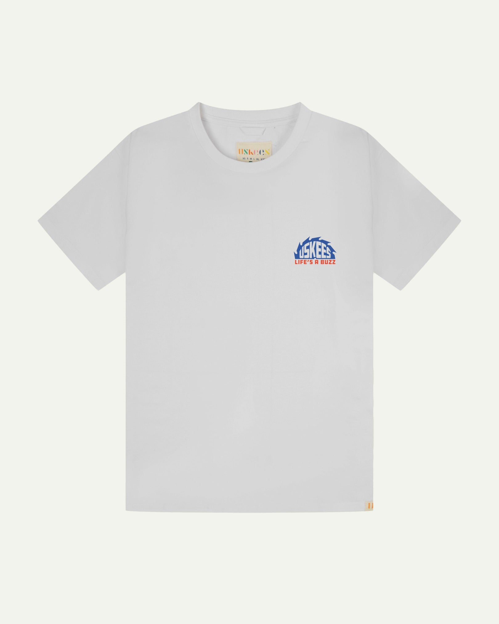 Front flat view of men's graphic t-shirt in white showing a smaller 'life's a buzz' graphic on the left breast and the Uskees branding labels on the neck and hem.