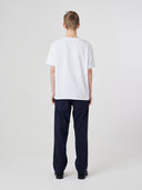 Back view of model wearing 7006 white organic cotton t-shirt.