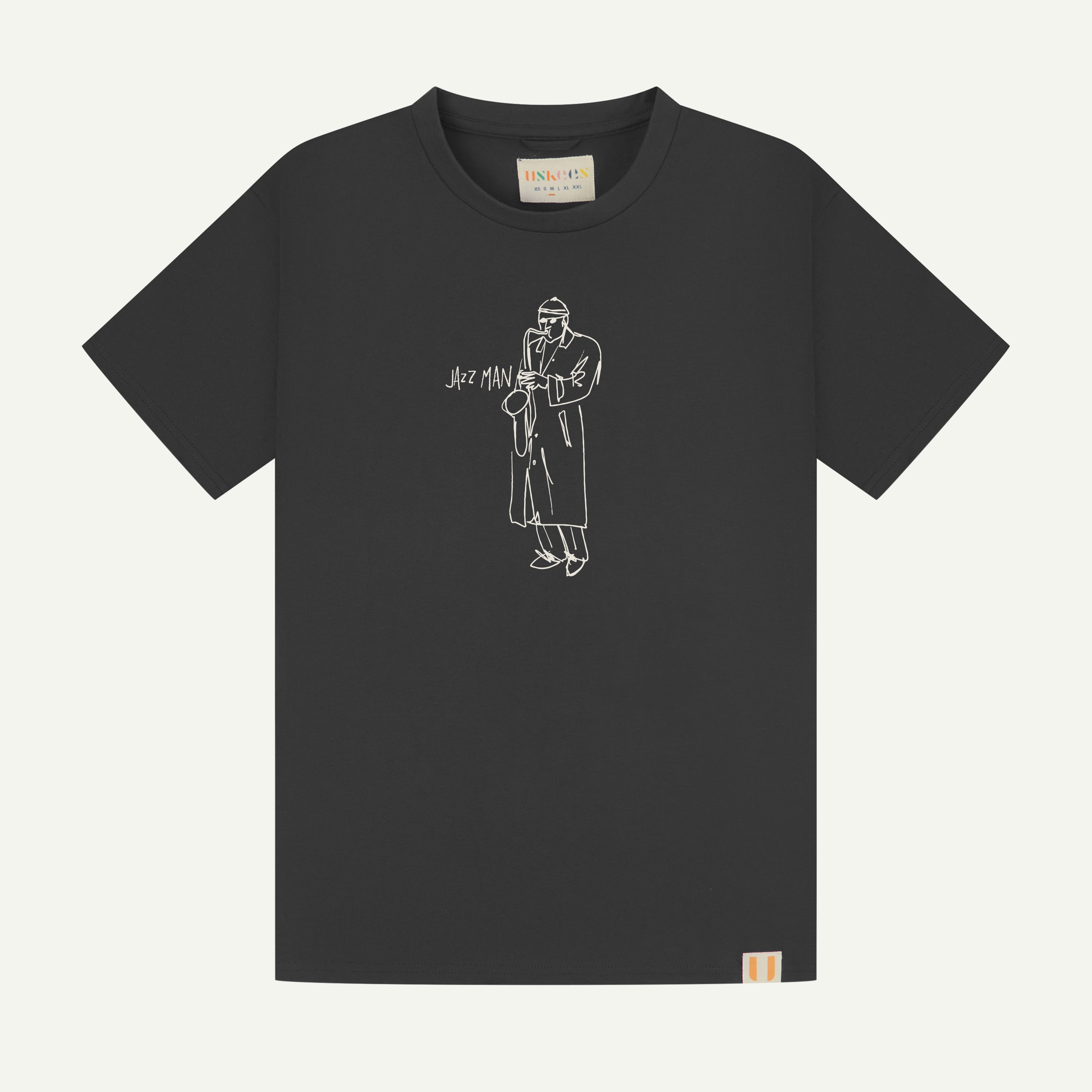front flat shot of uskees men's short sleeve  graphic Tee in faded black with the 'jazz man' line drawing on the front in white