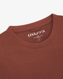 Close up shot of Uskees chestnut brown t=short sleeve t-shirt for men showing the neck branding