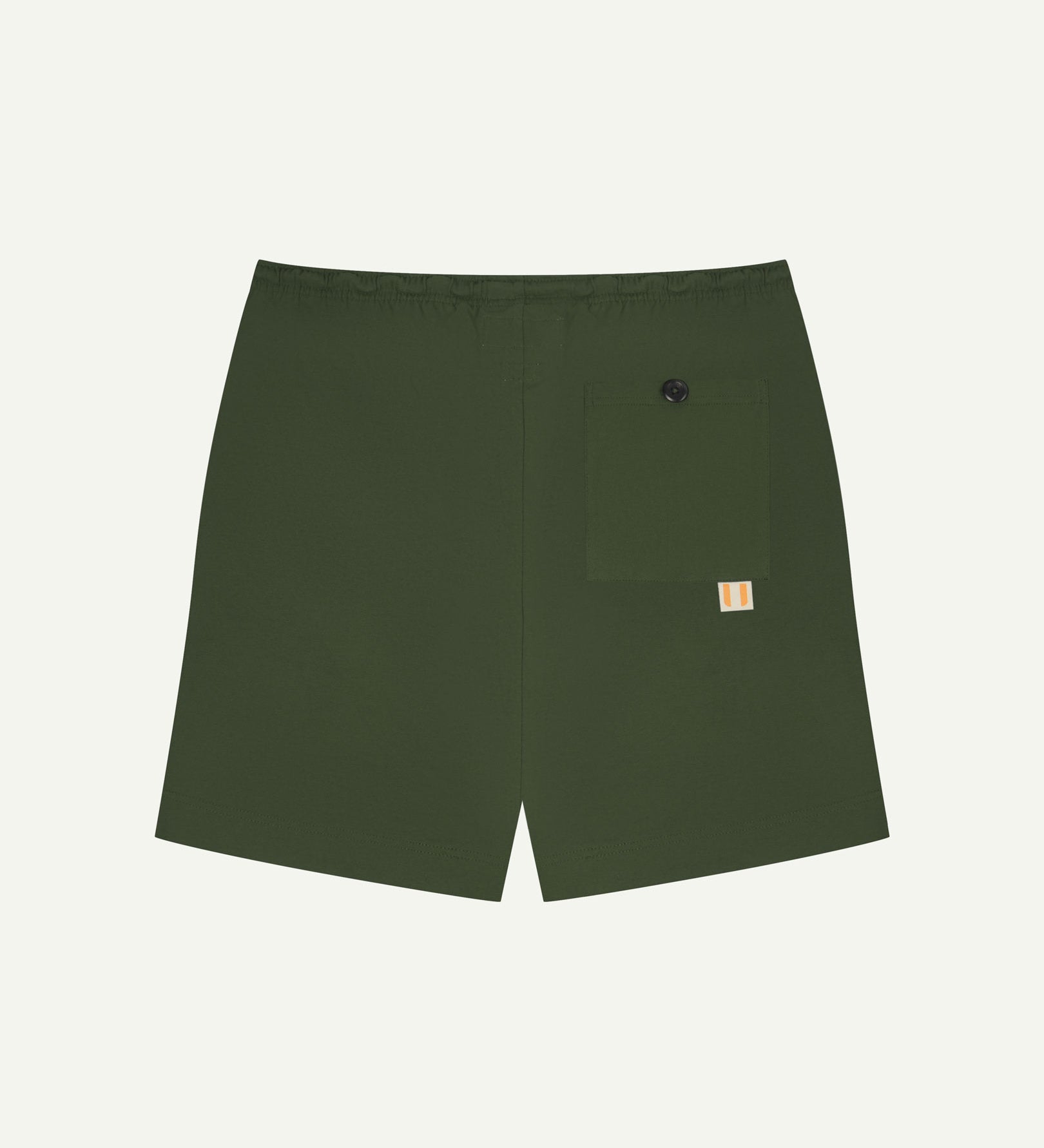Back view of coriander-green men's organic cotton 7007 men's shorts by Uskees against white background. Clear view of pocket and logo label.