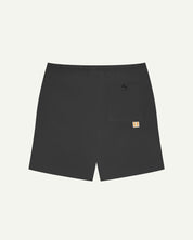 Back view of faded black men's organic cotton 7007 men's shorts by Uskees against white background. Clear view of pocket and logo label.