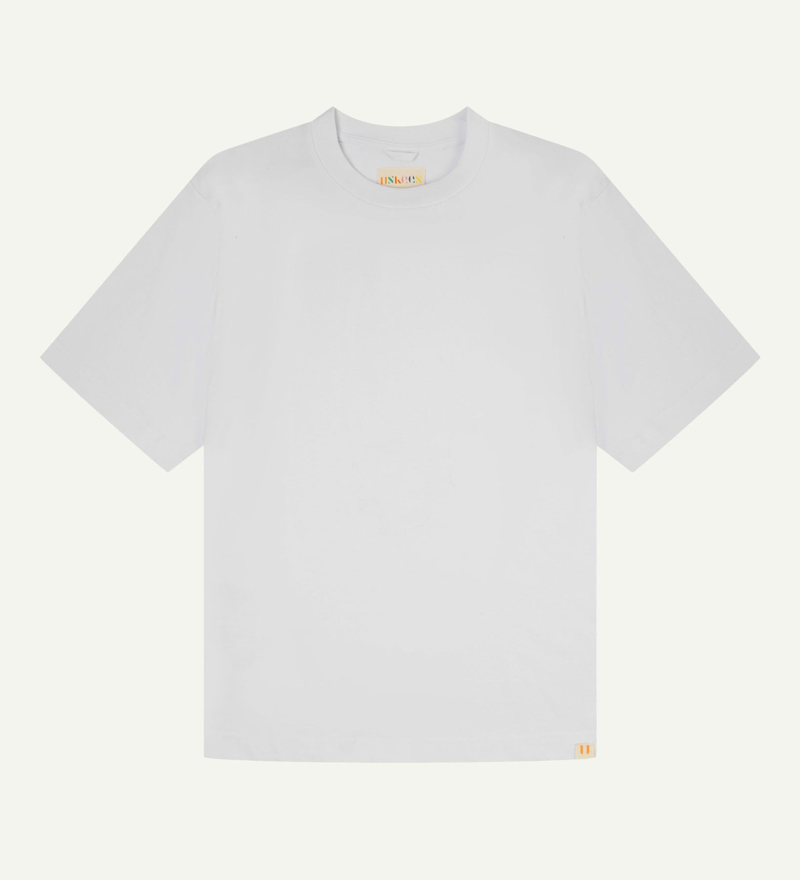Full flat view of white, organic cotton, oversized T-shirt from Uskees.