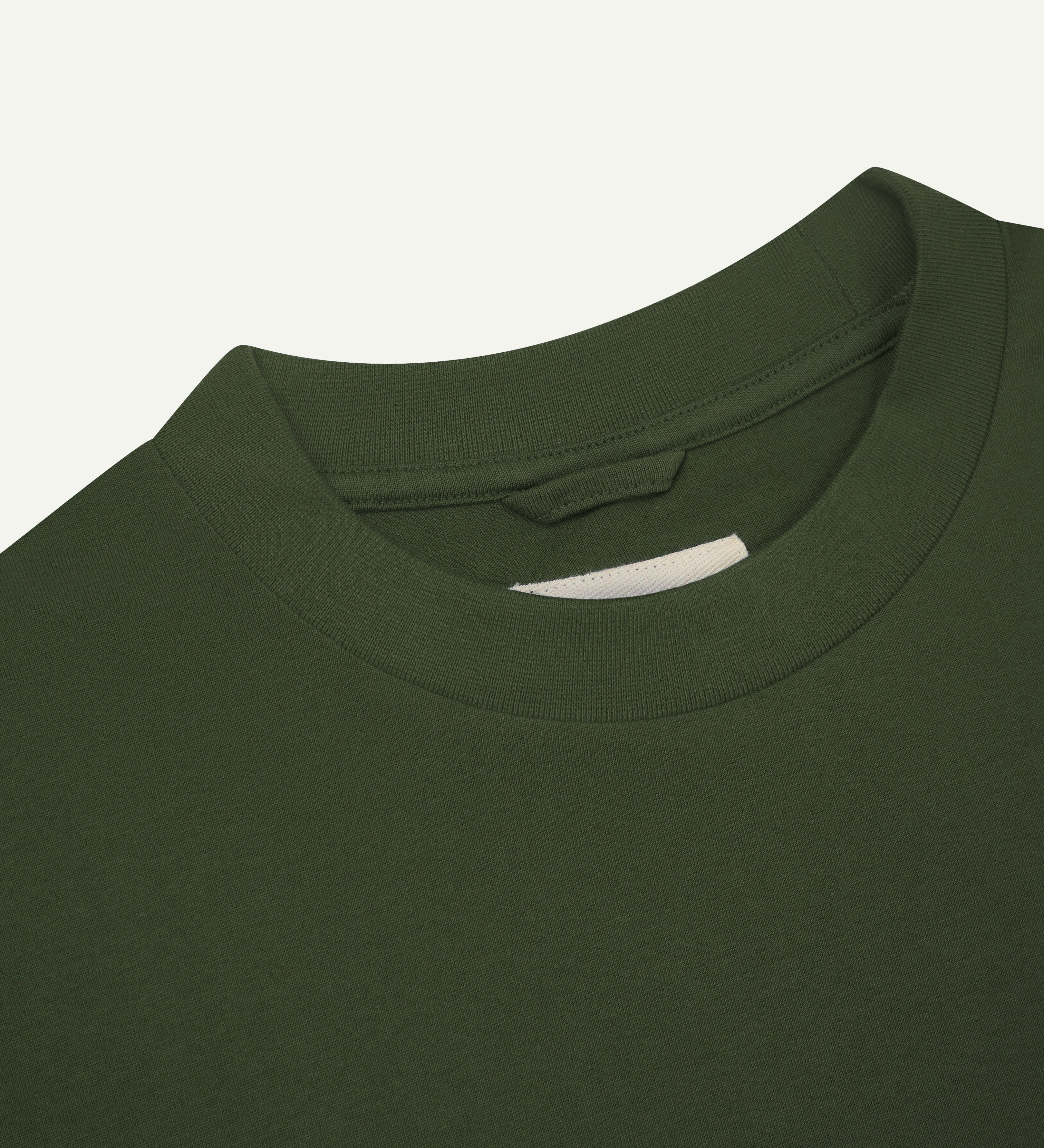 Close view of collar - mid-green oversized men's organic cotton T-shirt by Uskees.