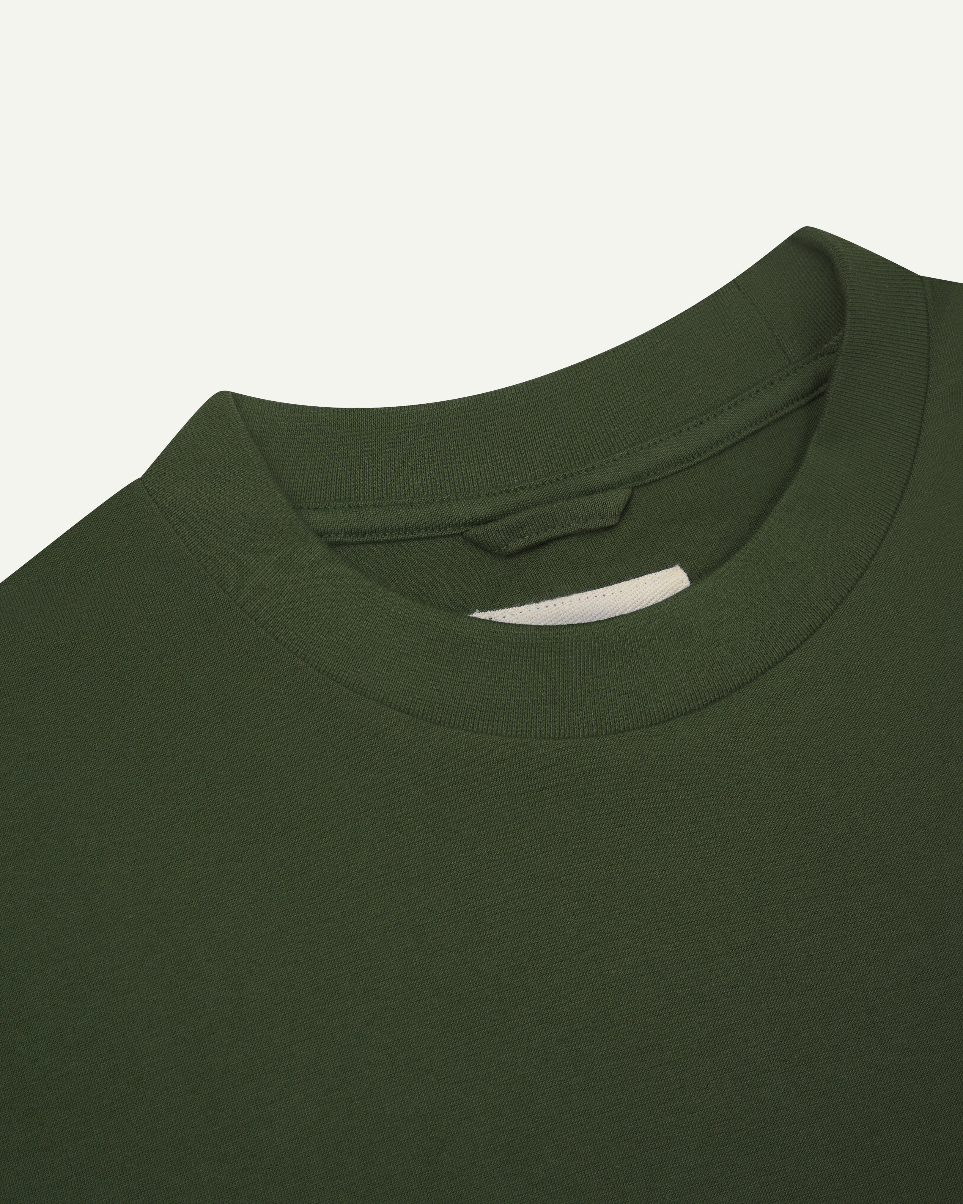 Close view of collar - mid-green oversized men's organic cotton T-shirt by Uskees.