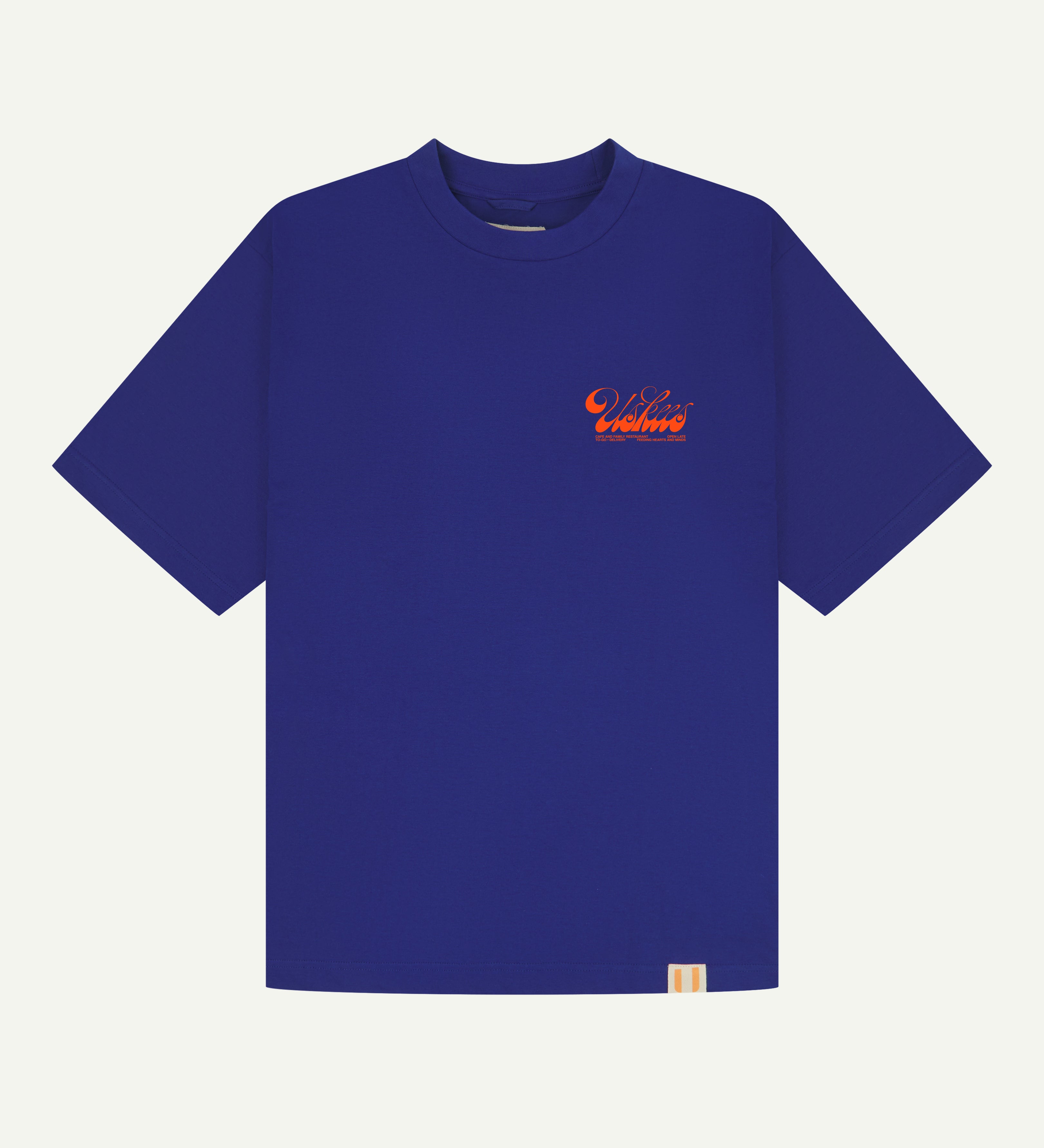 Front flat shot of uskees ultra blue relaxed fit graphic Tee for men showing the 'Diner' design in orange