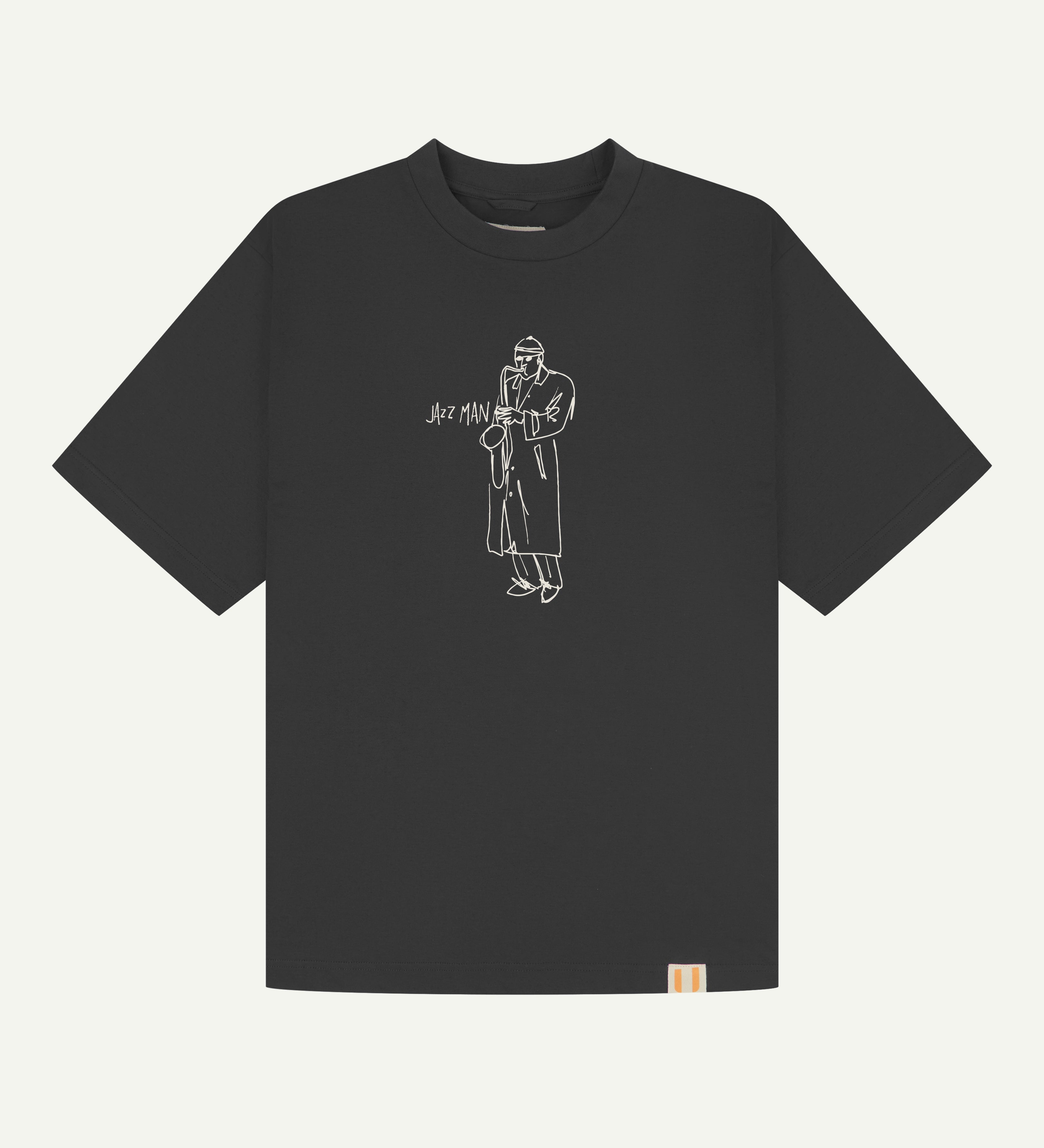 front flat shot of the uskees oversized graphic Tee for men in faded black showing the 'Jazz Man' line drawing in white