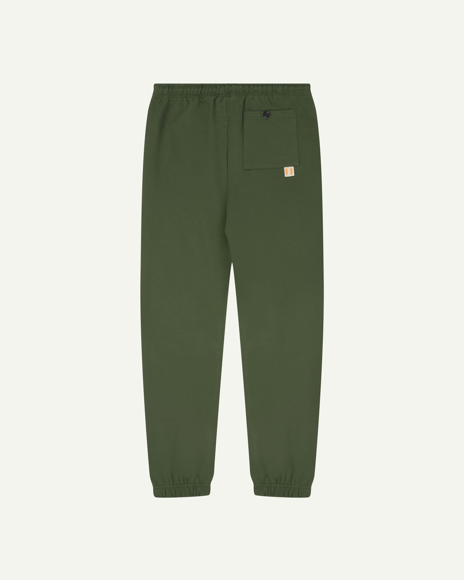 Back view of coriander-green organic cotton joggers by Uskees showing the back pocket.