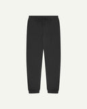 Front view of Uskees jogging pants in faded black organic cotton.