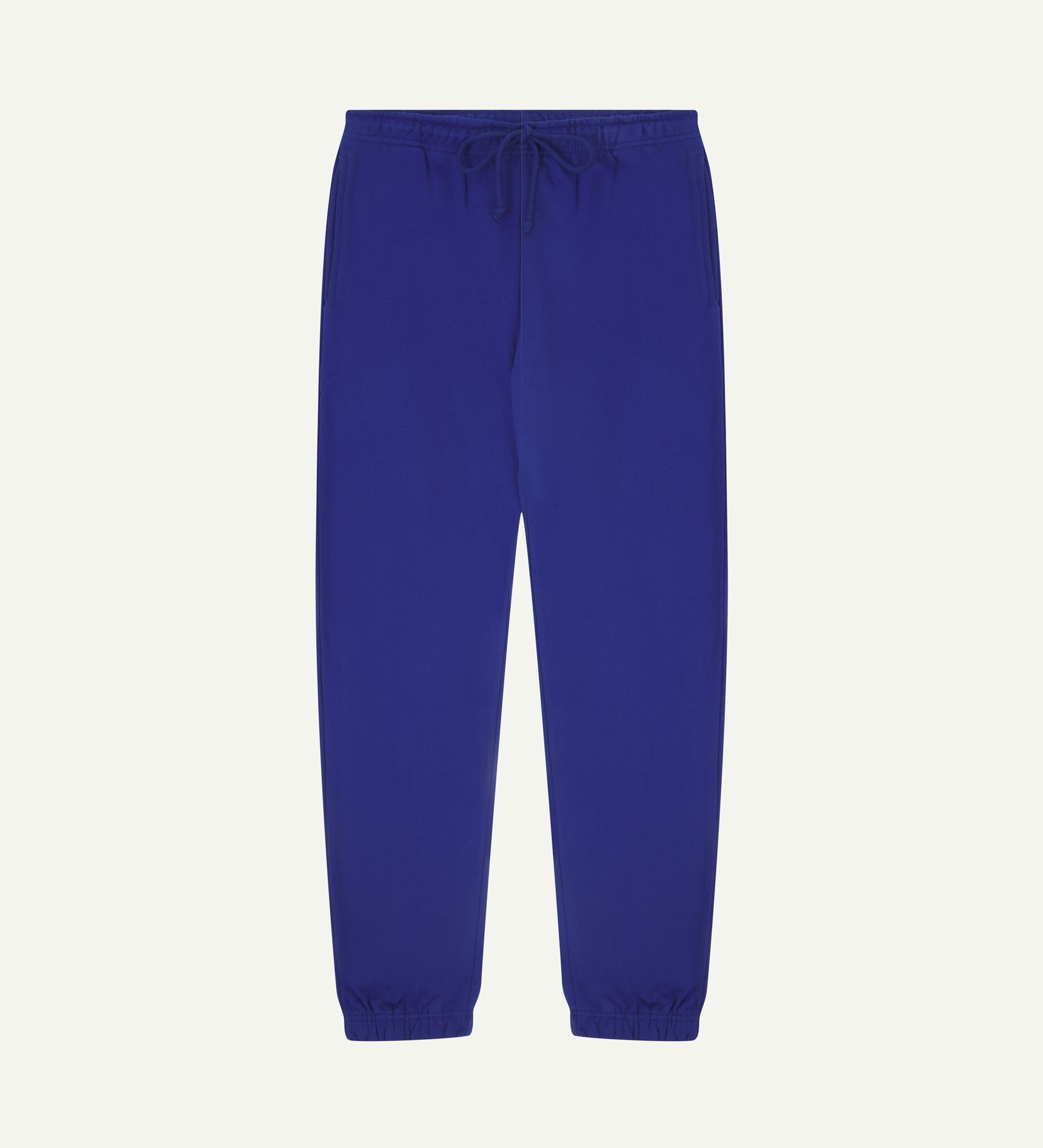 Front view of Uskees jogging pants in ultra-blue organic cotton.