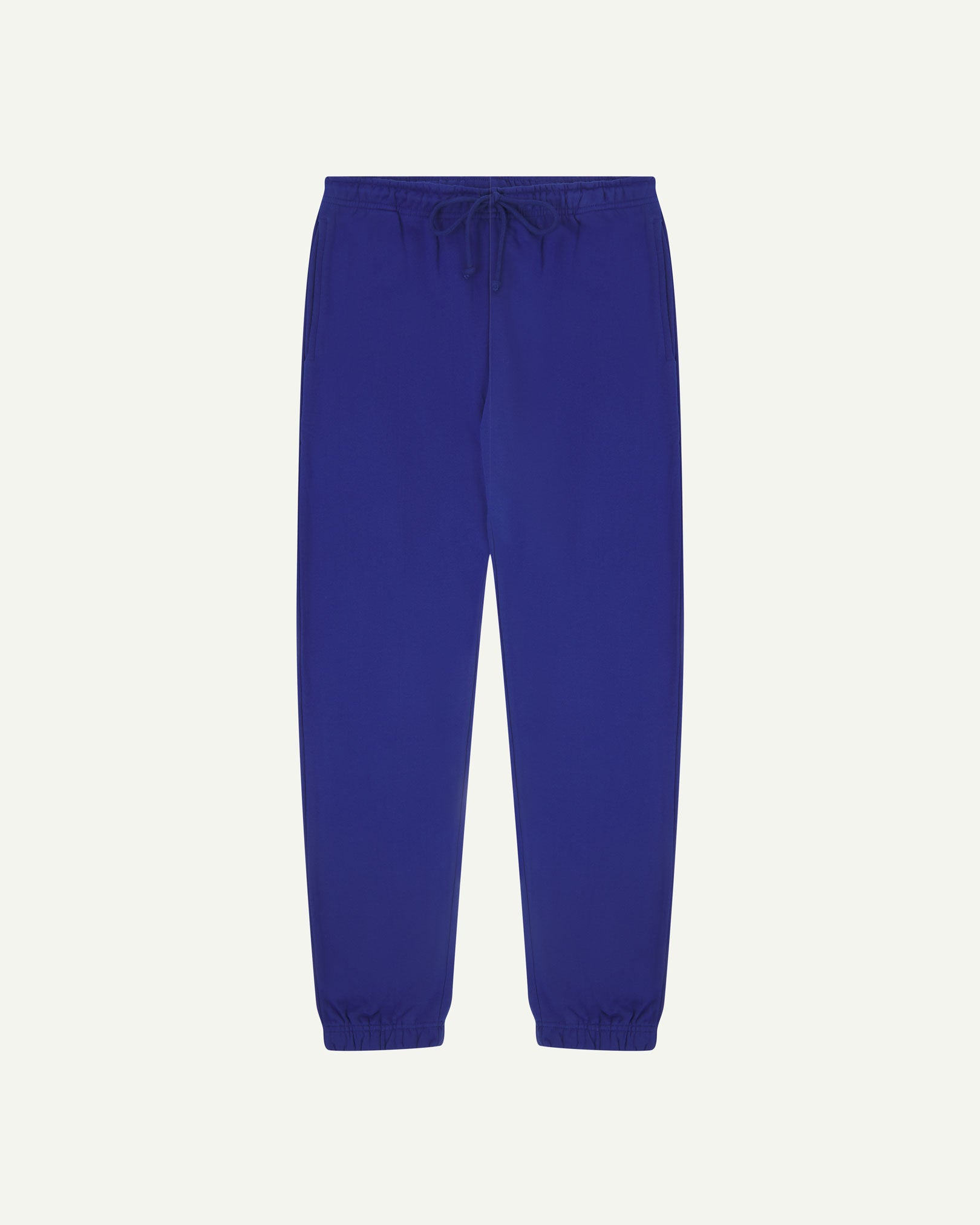 Front view of Uskees jogging pants in ultra-blue organic cotton.