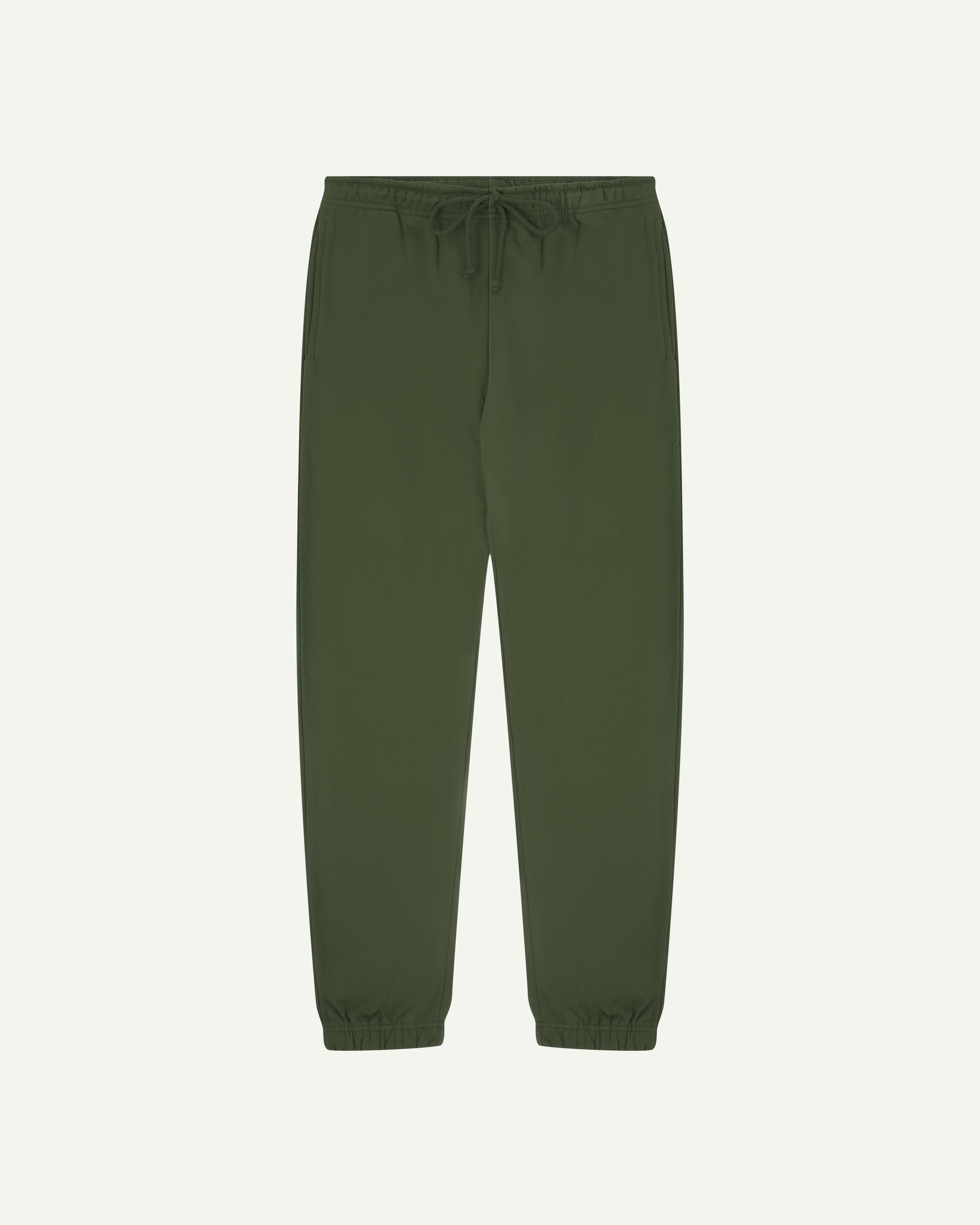 Front view of uskees men's jogging pants in mid-green organic cotton.