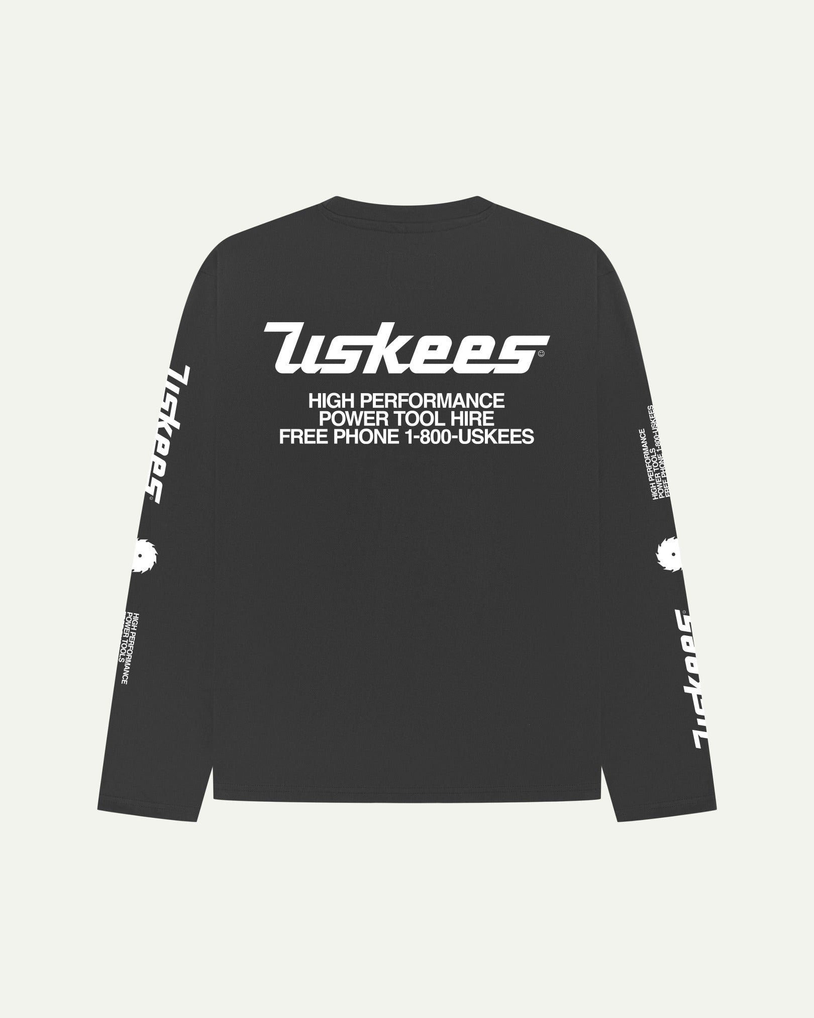 Reverse view of Uskees men's long-sleeve graphic t-shirt in black showing large 'Uskees Power Tools' motif on back.