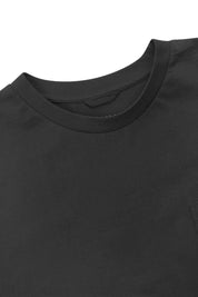 Neckline close-up of Uskees faded black organic cotton long-sleeve T-shirt showing hanging loop.